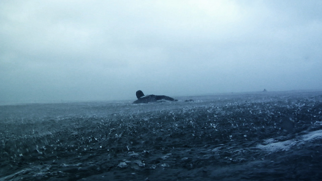 surfer paddling